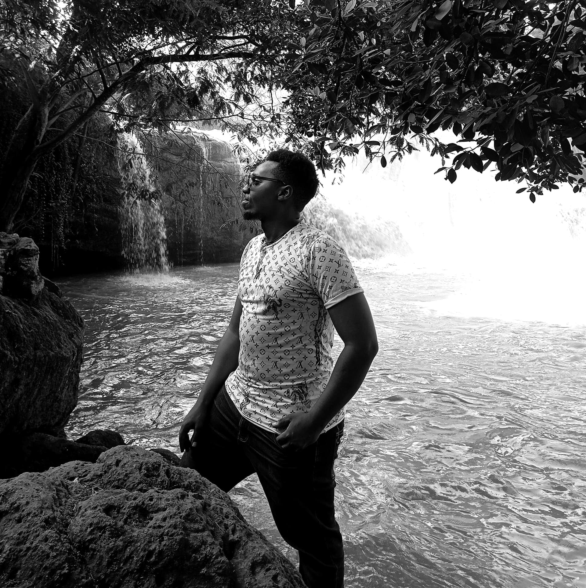 Levis Kibirie at a waterfall in Kenya: Fullstack Engineer and SaaS Founder