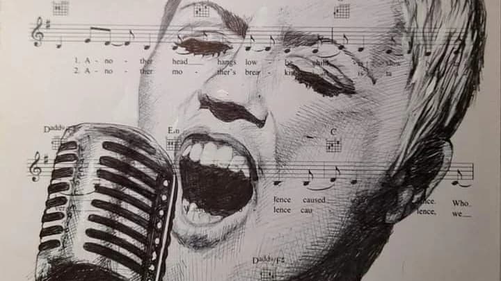 A pen drawing of Dolores O'Riordan singing into an old microphone, drawn over the sheet music for Zombie