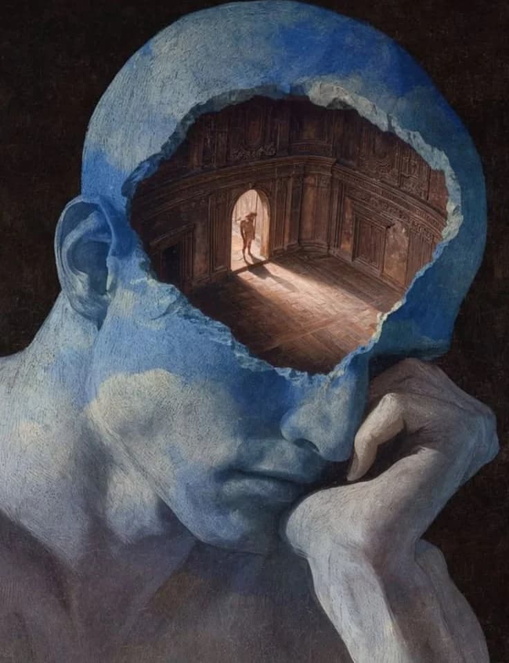 A painted head resting on a hand, with a hole in it revealing a grand room where a small figure stands in a lit doorway